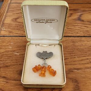 Genuine Amber pin with Lietuva printed on silver tone stick pin